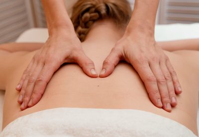 close-up-therapist-massaging-back